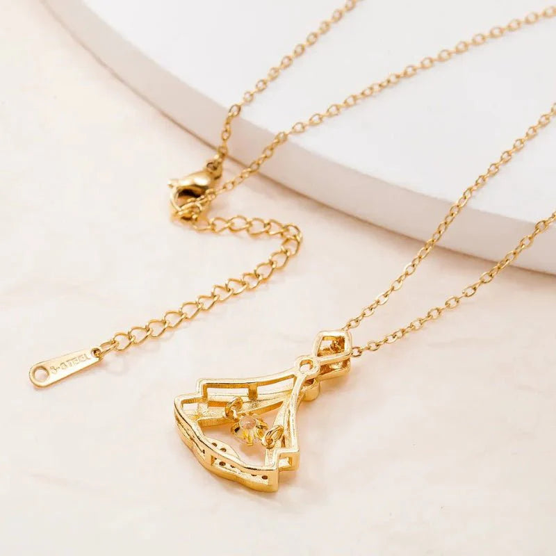 Stylish rhinestone pendant necklace worn as a fashion accessory.