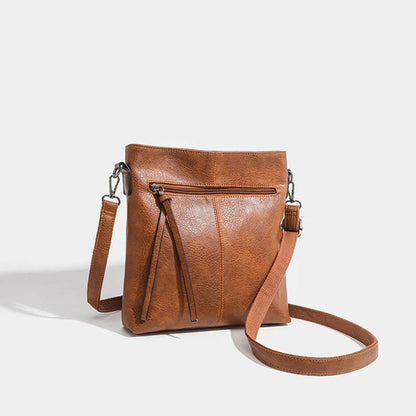  Retro style brown artificial leather handbag with textured finish, perfect for men and women. 